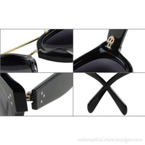 Acetate sunglasses in black with gold metal